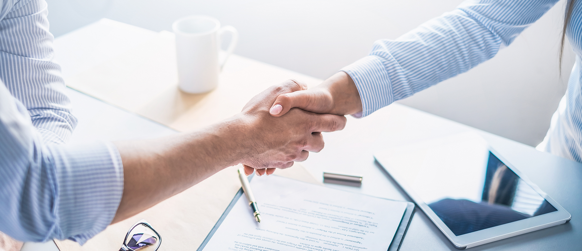 Business people shaking hands, finishing up meeting.