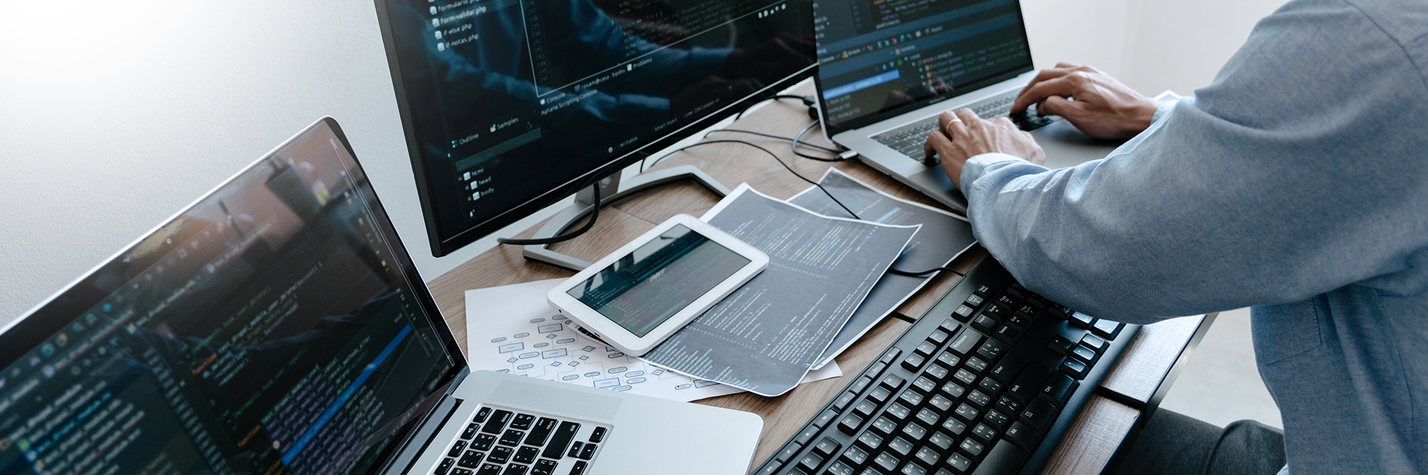 Programmer Typing Code on desktop computer, Developing programmi